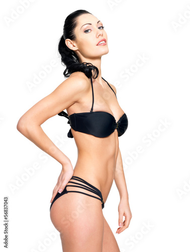 Slim body of young woman in black bikini