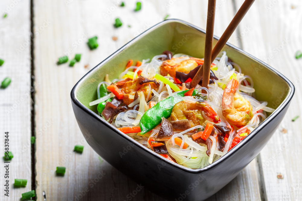 Chinese mix vegetables and rice noodles on old wooden table Chinese mix vegetables and rice noodles on old wooden table