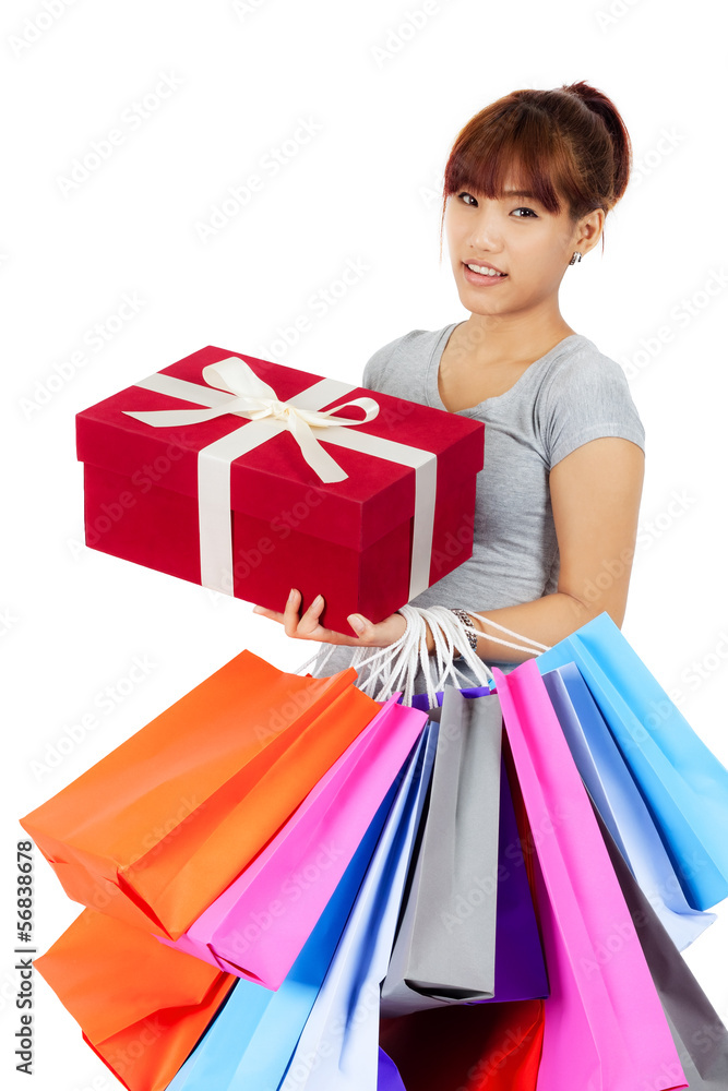 Isolated young Asian woman with shopping bags Isolated young Asian woman with shopping bags