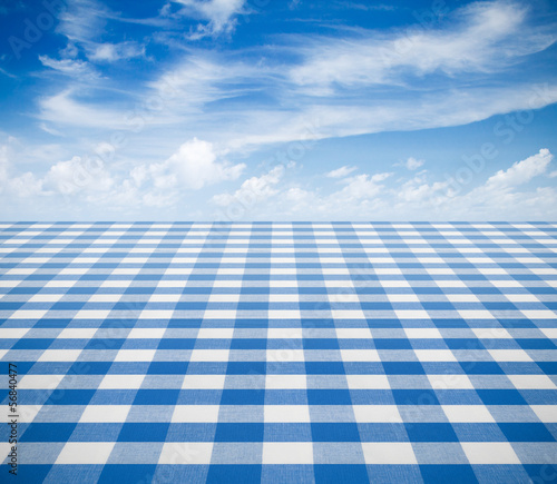 blue tablecloth backgound with sky