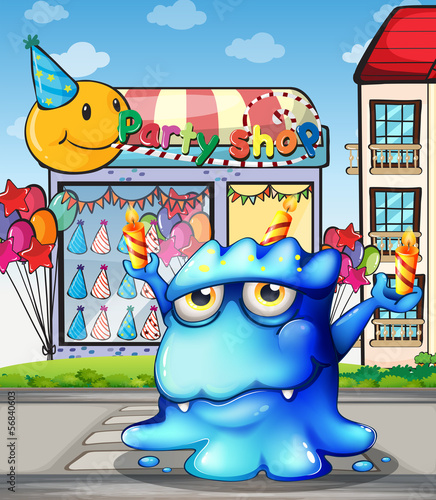 A blue monster balancing the candles in front of the party shop