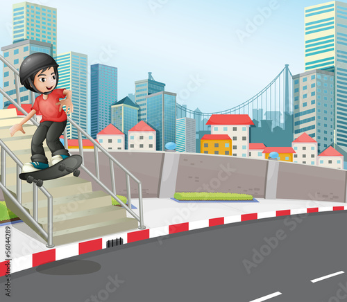 A boy skateboarding at the street near the stairs