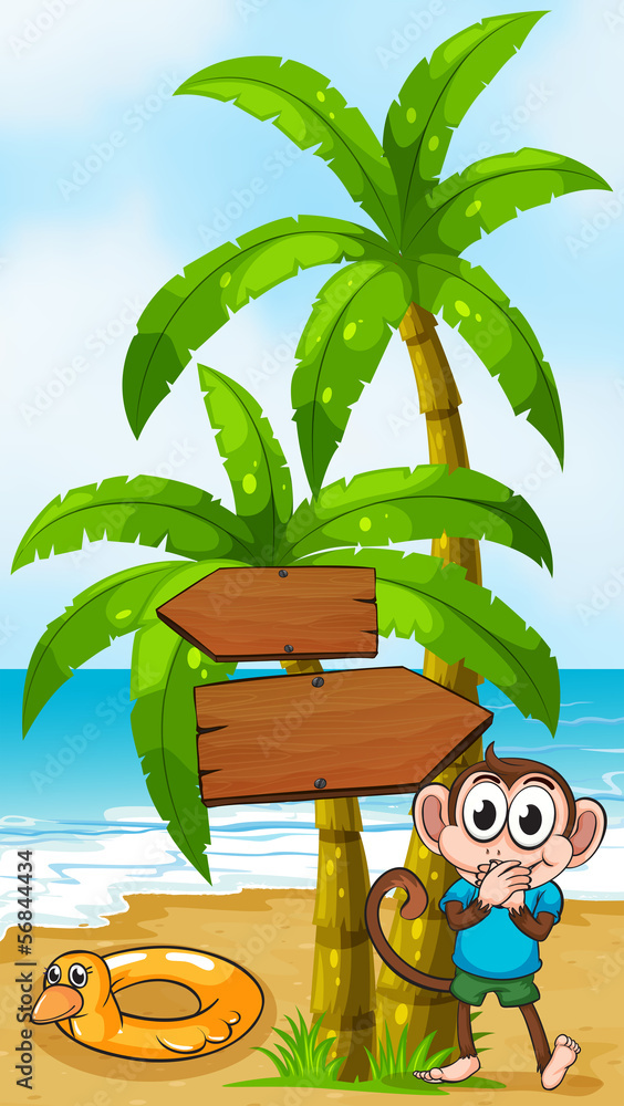 A monkey at the beach with a toy standing near the palm tree