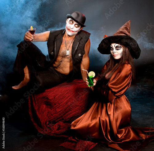 man and woman  wearing  as  vampire and witch. Halloween photo