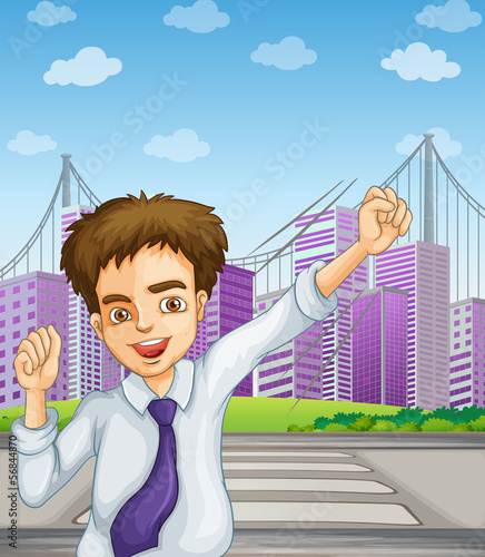 A happy businessman near the pedestrian lane