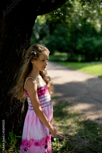 Little blonde girl in the park
