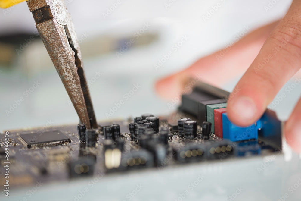 Fototapeta premium Extreme close up of pliers repairing hardware
