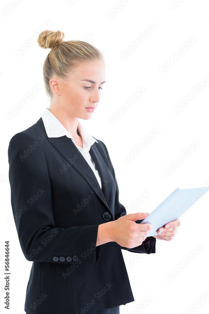 Side view of attractive businesswoman working with her tablet Side view of attractive businesswoman working with her tablet
