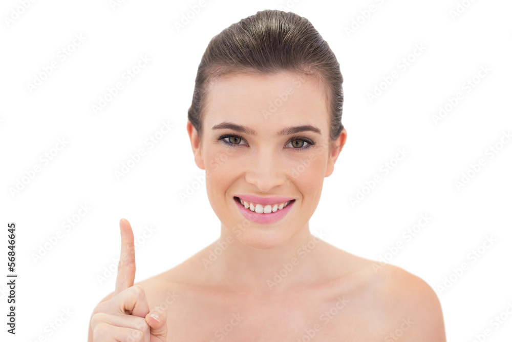 Pleased natural brown haired model raising her finger Pleased natural brown haired model raising her finger