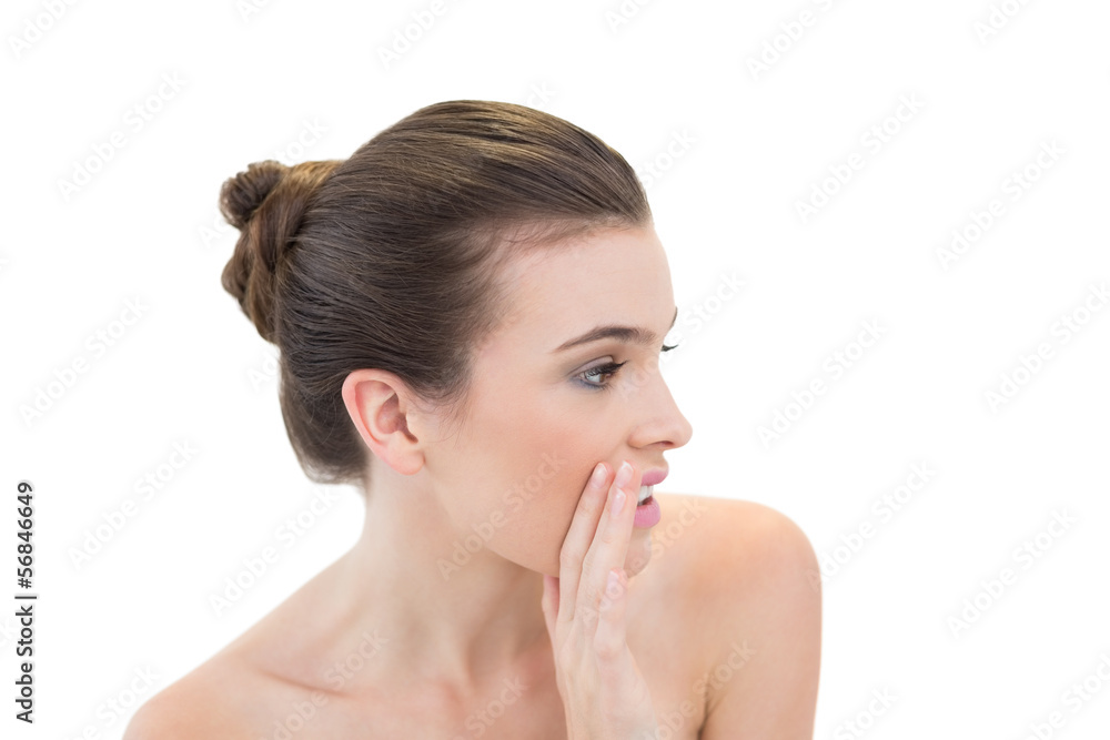 Beautiful natural brown haired model whispering a secret Beautiful natural brown haired model whispering a secret