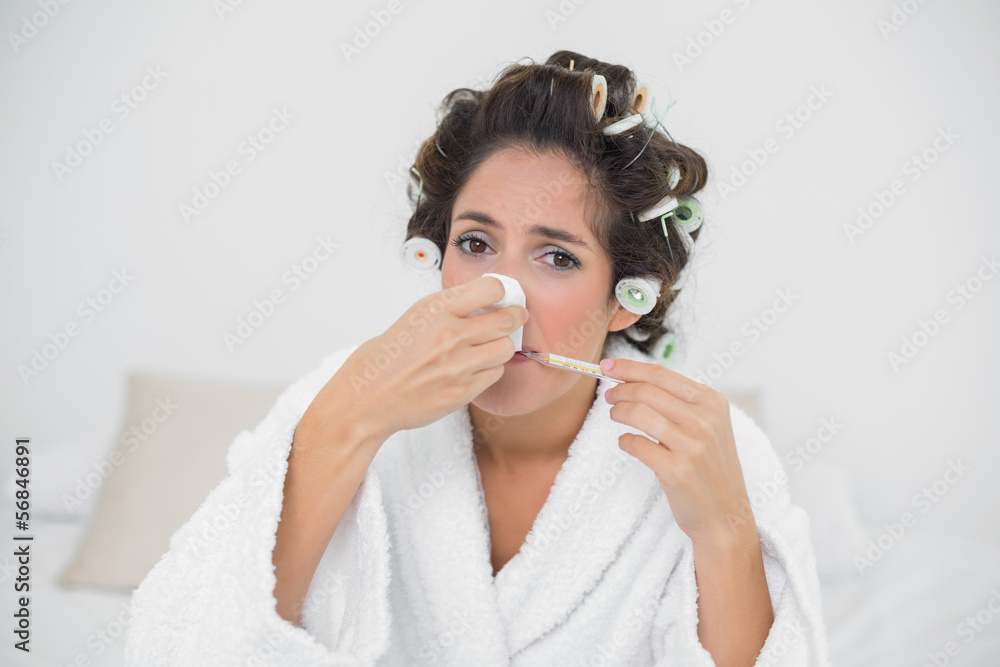 Sad natural brunette blowing her nose Sad natural brunette blowing her nose