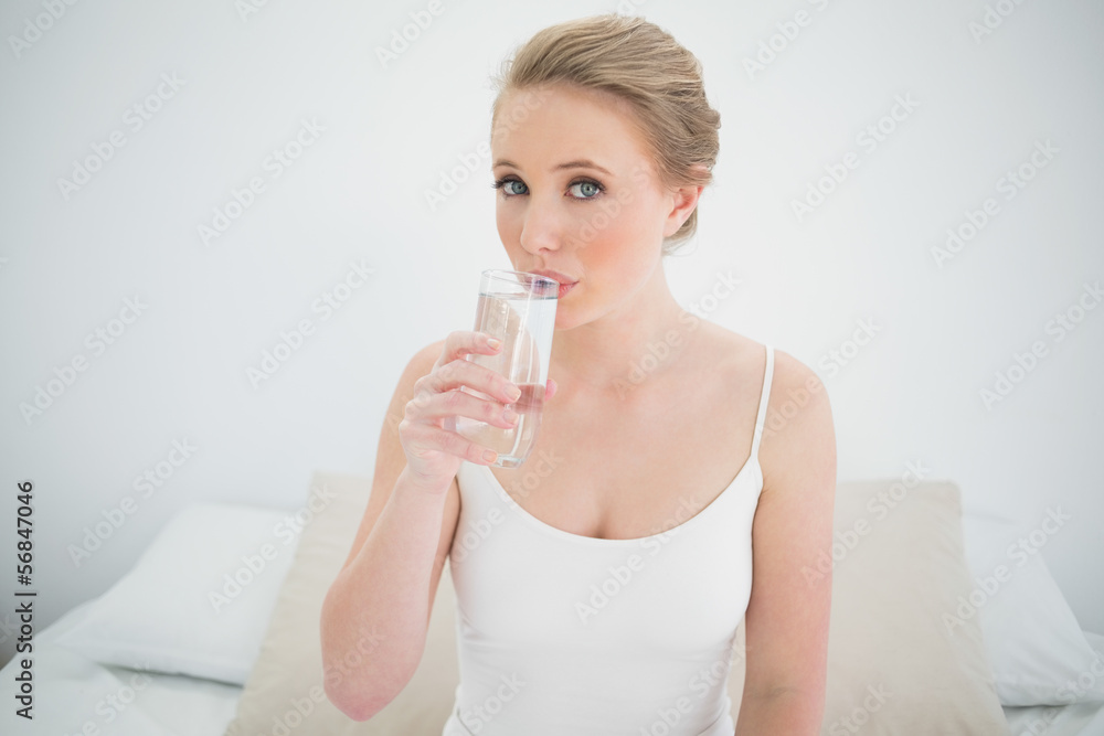 Natural content blonde drinking a glass of water Natural content blonde drinking a glass of water