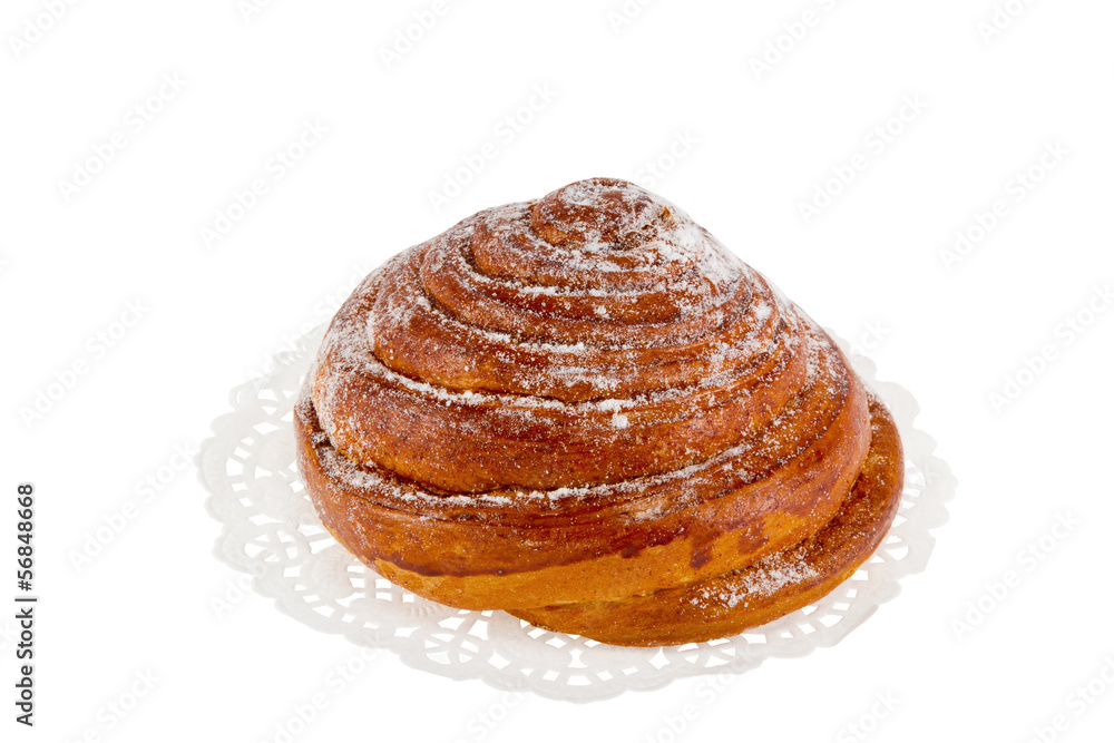 bun on a white napkin with powdered sugar bun on a white napkin with powdered sugar