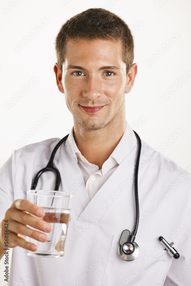 Doctor man with stethoscope showing a glass of water. Doctor man with stethoscope showing a glass of water.
