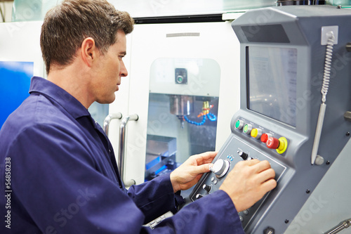 Photos Engineer Operating Computer Controlled Milling Machine