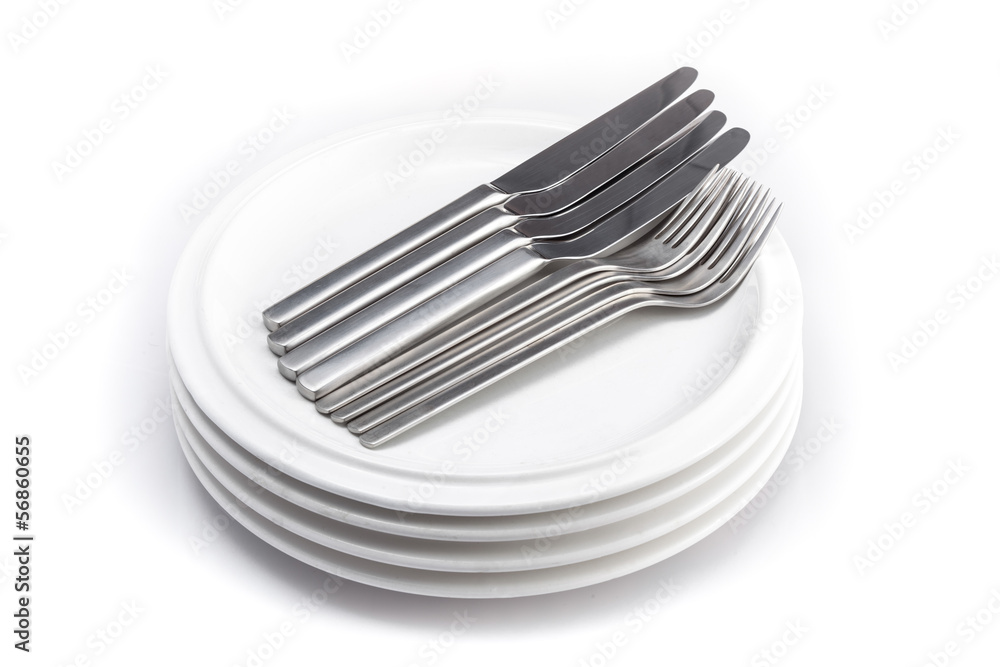 stack of plates knifes and fork isolated on a white background stack of plates knifes and fork isolated on a white background