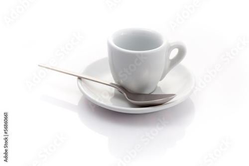 empty espresso cup with a spoon isolated on a white background