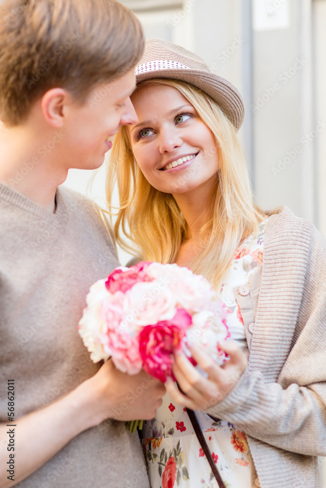 couple with flowers in the city couple with flowers in the city