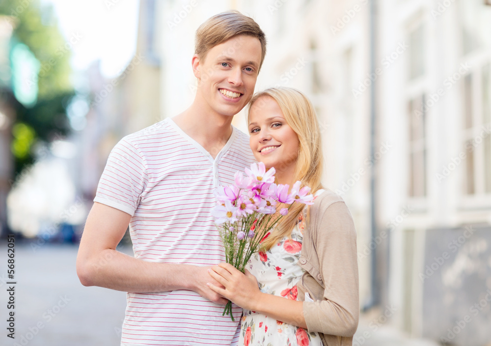 couple with flowers in the city couple with flowers in the city