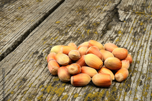 Hazelnuts on wooden background