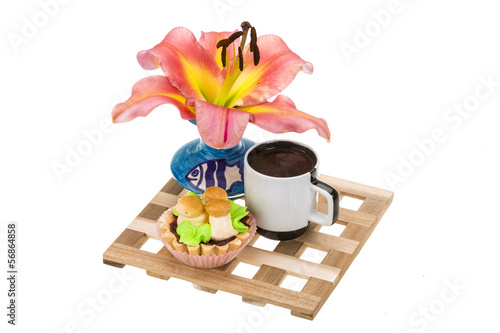 Fototapeta Naklejka Na Ścianę i Meble -  Coffee with cupcake and lilly flower
