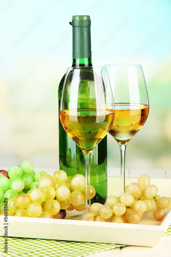 Ripe grapes, bottle and glasses of wine