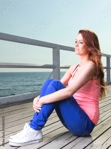 Attractive girl Young woman pier sea