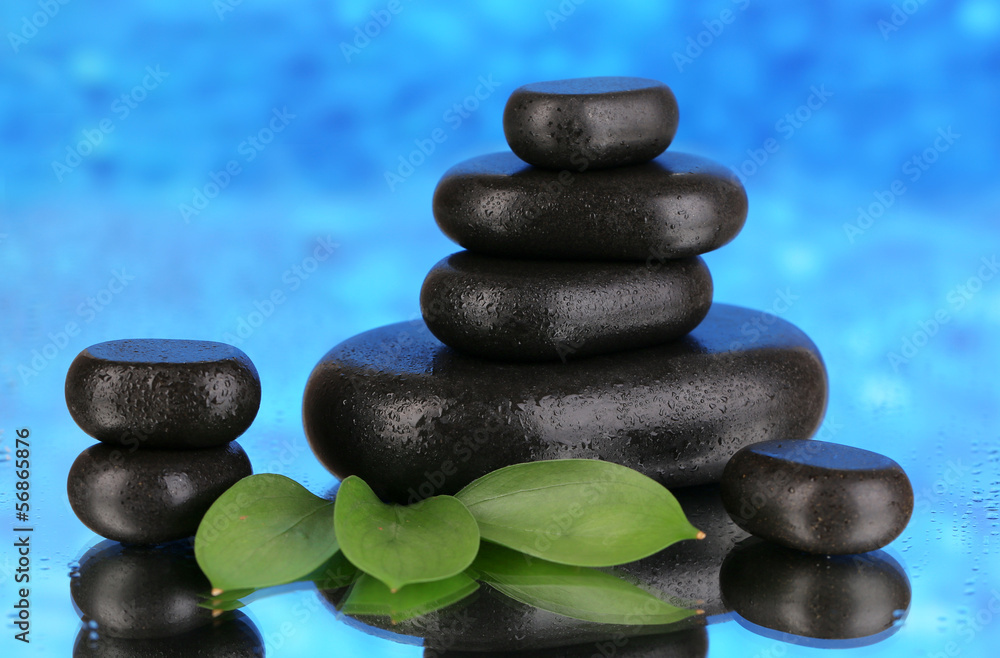 Spa stones on blue bright background Spa stones on blue bright background