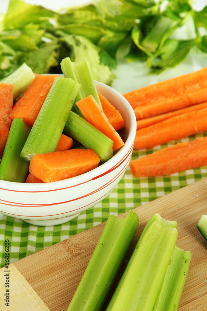 Fresh green celery with vegetables on table close-up Fresh green celery with vegetables on table close-up