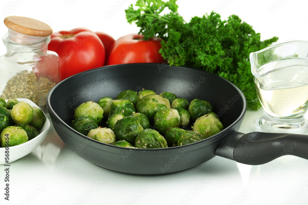 Fresh brussels sprouts in pan with vegetables and spices Fresh brussels sprouts in pan with vegetables and spices