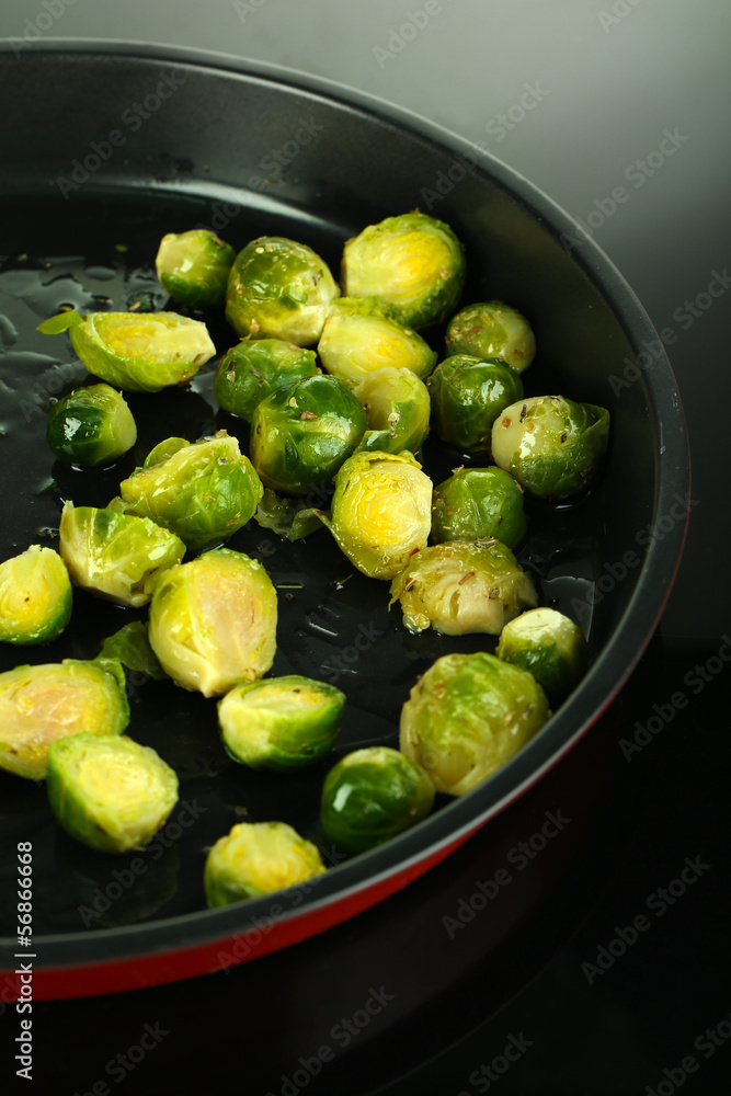 Fresh brussels sprouts in pan on cooking surface close-up Fresh brussels sprouts in pan on cooking surface close-up