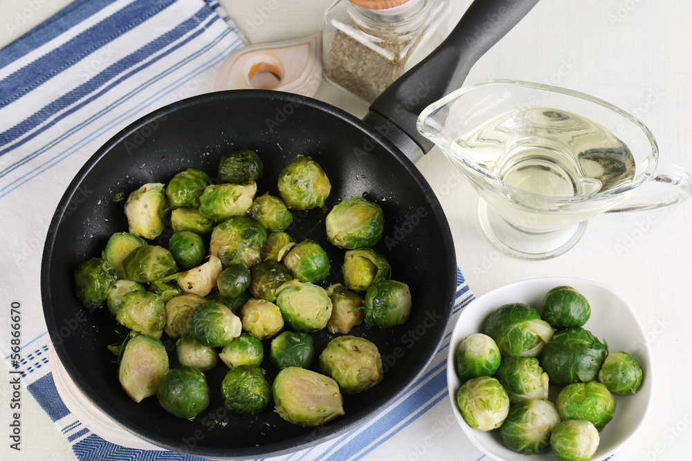 Fresh brussels sprouts in pan with vegetables and spices Fresh brussels sprouts in pan with vegetables and spices