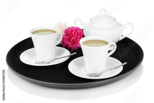 Cups of coffee on tray isolated on white