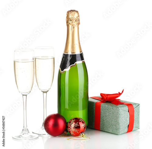 Bottle of champagne with glasses and Christmas balls isolated