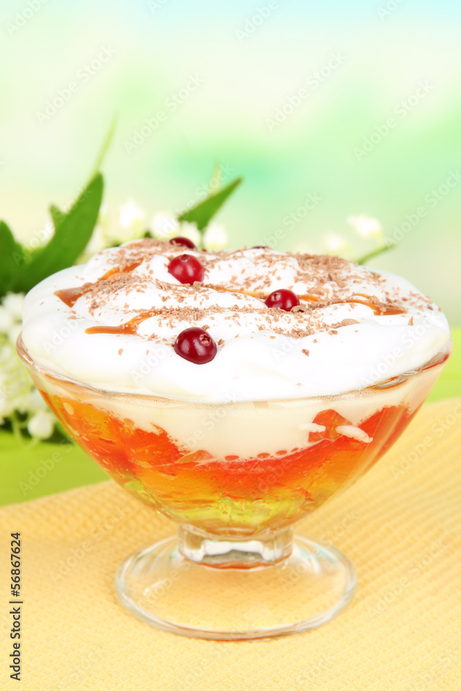 Tasty jelly in bowl on table on light background Tasty jelly in bowl on table on light background