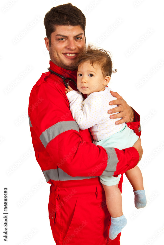 Smiling paramedic man holding baby Smiling paramedic man holding baby