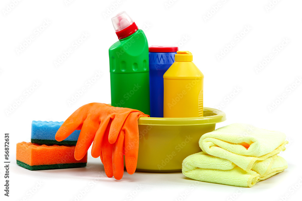 Detergent bottles, rubber gloves and cleaning sponge on a white Detergent bottles, rubber gloves and cleaning sponge on a white