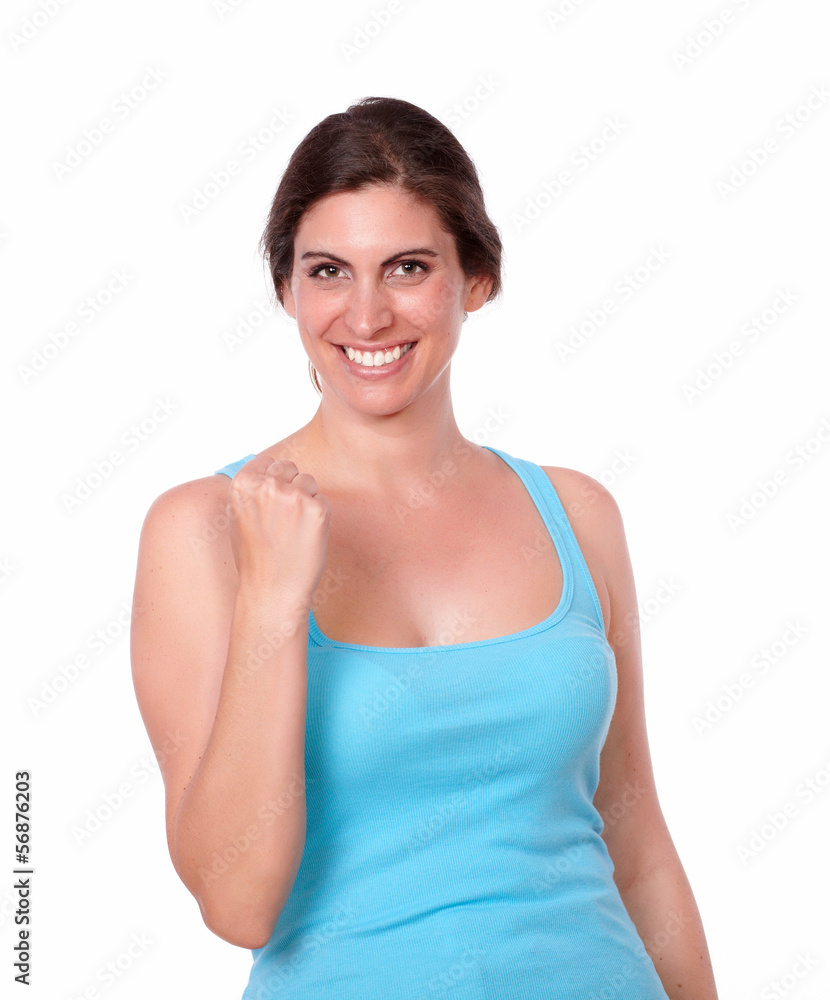 Fit lady in gym clothing celebrating a victory Fit lady in gym clothing celebrating a victory