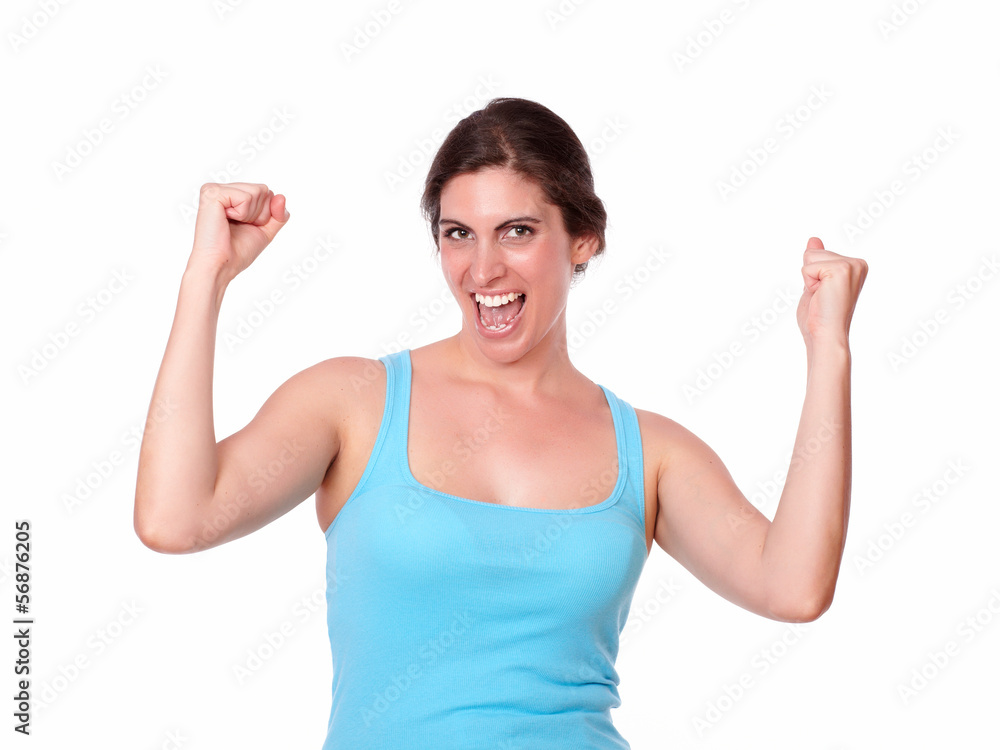 Fit female in gym clothing celebrating a victory Fit female in gym clothing celebrating a victory