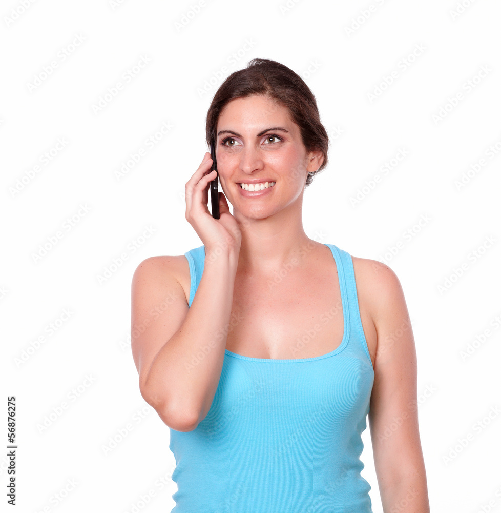 Pretty woman in gym clothing speaking on cellphone Pretty woman in gym clothing speaking on cellphone