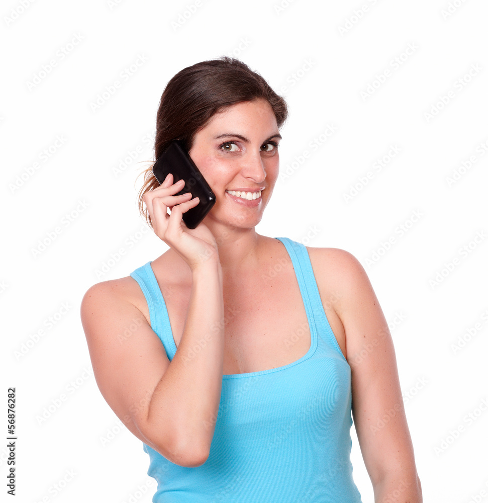 Pretty young woman speaking on cellphone Pretty young woman speaking on cellphone