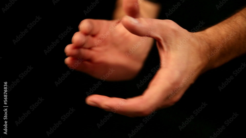 two hands in front of an black background giving applause two hands in front of an black background giving applause