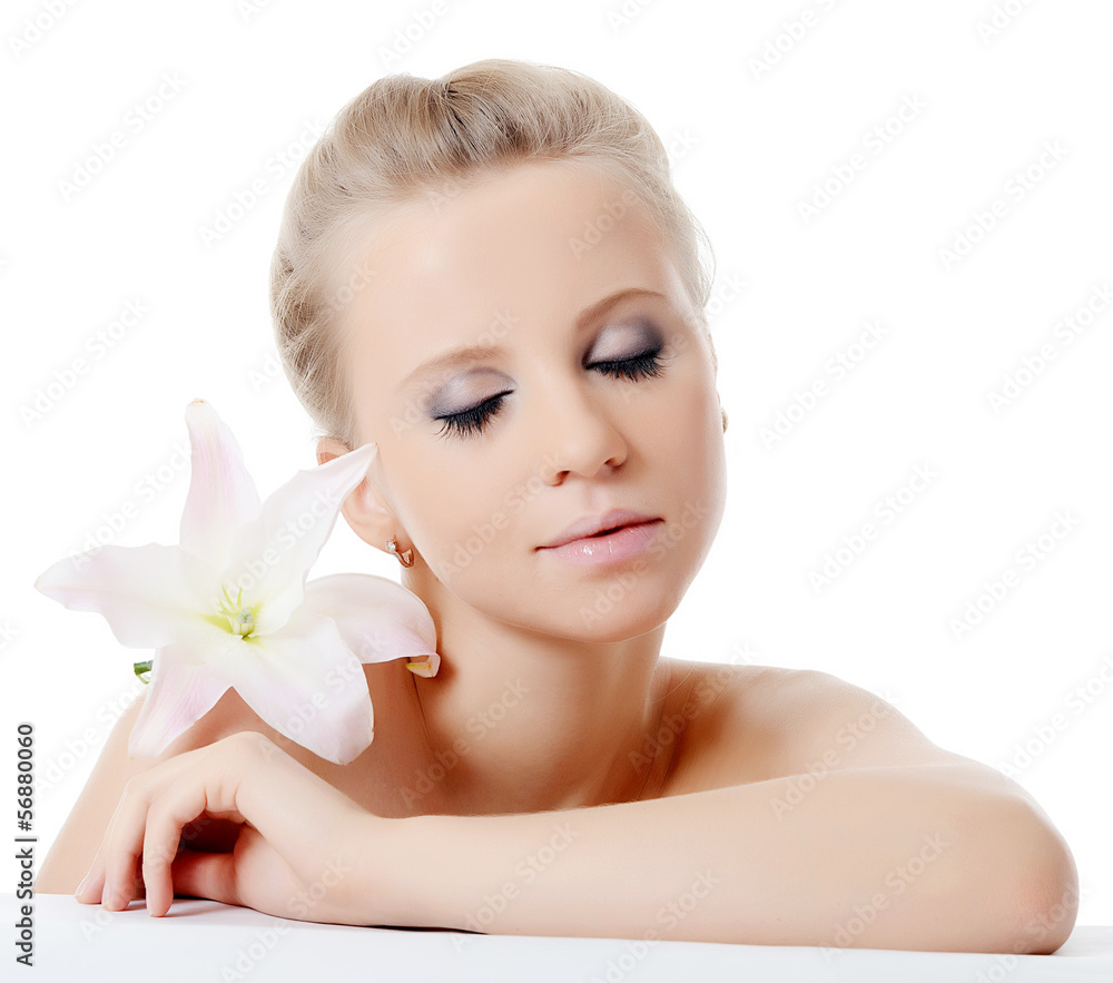 The beautiful blonde woman with lily flower The beautiful blonde woman with lily flower
