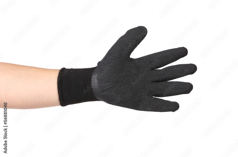 Obraz premium Black rubber protective glove on hand.