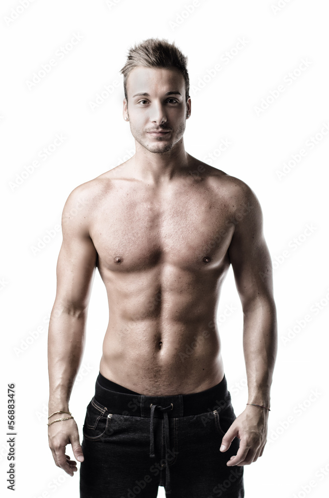 Muscular, friendly young man standing, shirtless