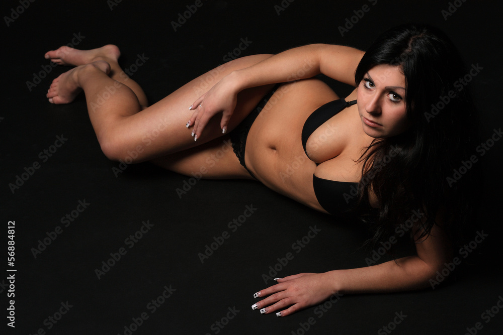 Fototapeta premium Beautiful brunette in the studio