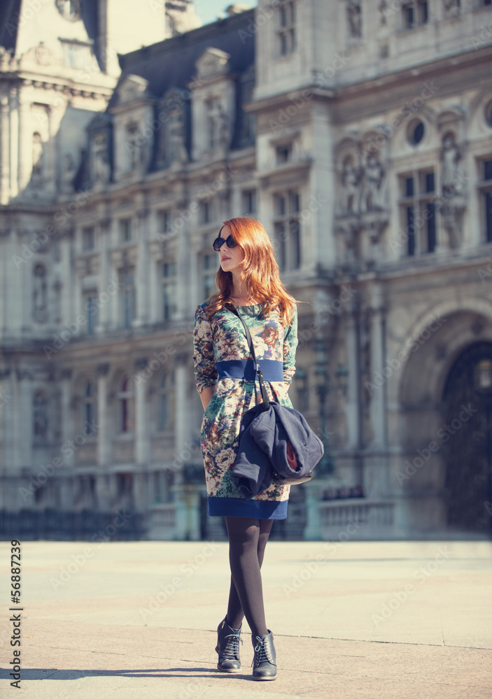 Style girl near retro building in Paris