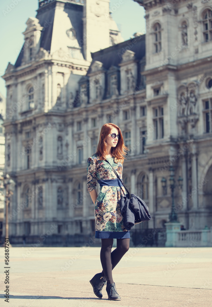 Style girl near retro building in Paris