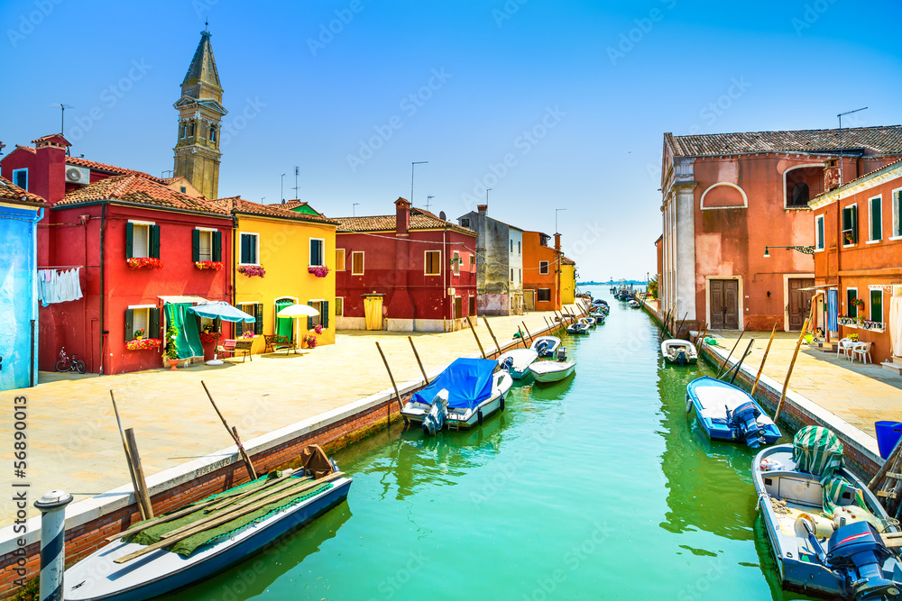Fototapeta premium Venice landmark, Burano canal, houses, church and boats, Italy
