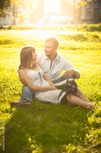 Couple hugging on lawn at park © Кирилл Рыжов